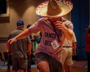 man dancing wearing sombero hat