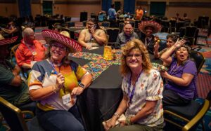 people smiling sitting around table