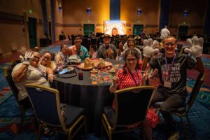 people smiling sitting around table