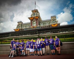 group of people smiling at disney world