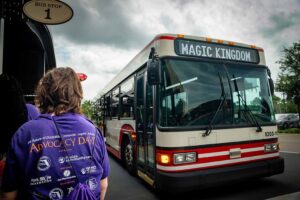 people loading buses for disney world